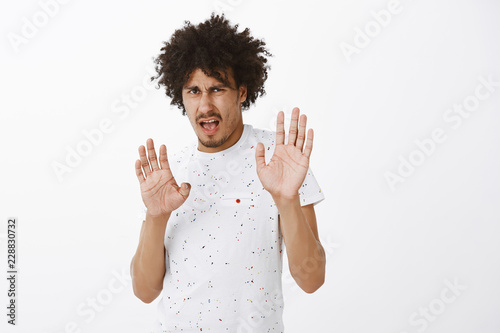 Gosh No Take It Away Portrait Of Displeased And Disgusted Cute Hispanic Guy With Moustache And
