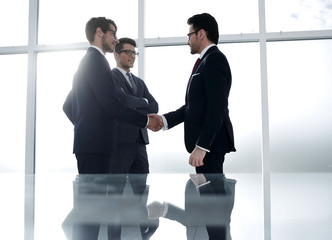 Wall Mural - reliable handshake of business partners