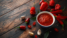 Spicy Hot Sweet Chili Sauce With Mix Of Chilli Pepper, Garlic And Tomatoes On Rustic Wooden Background