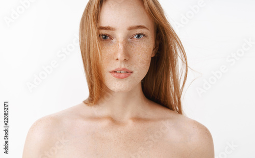 Close-up shot of sensual feminine and attractive redhead female standing naked o Poster Mural XXL