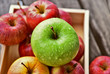 colorful of 3 Type of apple,Gala,Granny Smith,Golden Delicious in wooden box and wooden background.