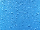 Fototapeta Natura - Blue water drops, detail of blue surface water-repellent on glass for background.