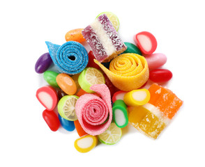 Pile of delicious colorful chewing candies on white background, top view