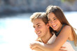 © Antonioguillem - Happy couple of teens flirting on the beach