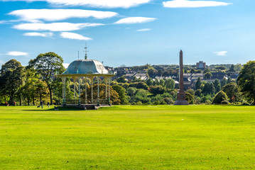 A large lawn with a scenic arbour and McGrigor obelisk in Duthie Park, Aberdeen