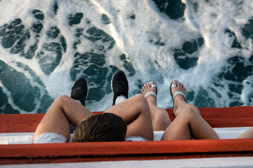 Wall Mural - elevated view of close up detail from man and woman couple traveling on the boat