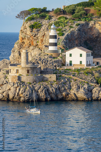 lighthouse and ship