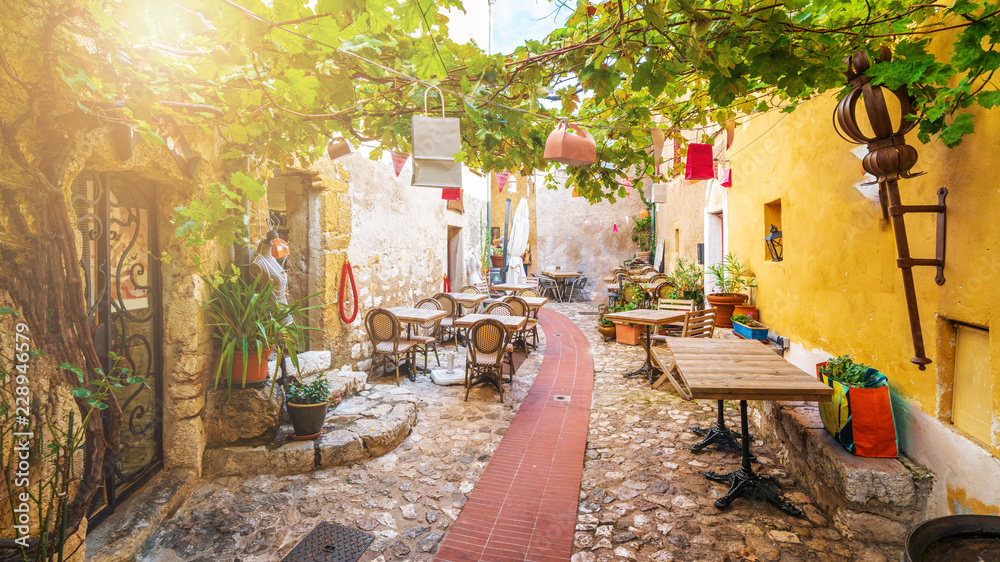 Street in medieval Eze village at french Riviera coast, Cote d'Azur, France - obrazy, fototapety, plakaty 