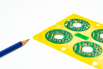 Electronic product design concept,printed circuit board(PCB) include pencil 2B with isolated white background,PCB