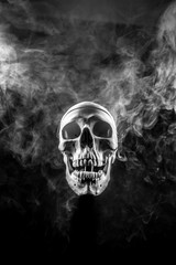 Wall Mural - Front of real skull in abstract smoke isolated on black background.