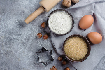 Baking ingredients for pastry on the gray table backround. Top view with copy space