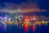 Fototapeta Nowy Jork - Aerial view of illuminated Hong Kong skyline. Hong Kong, China