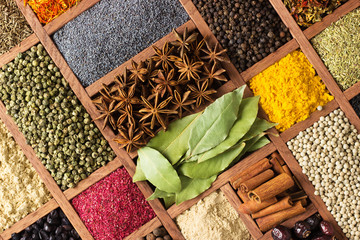 Wall Mural - Bright herbs and spices in wooden trays on shop window. Set seasonings for cooking, in  box with cells.