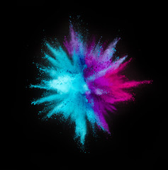 Colored powder explosion on black background