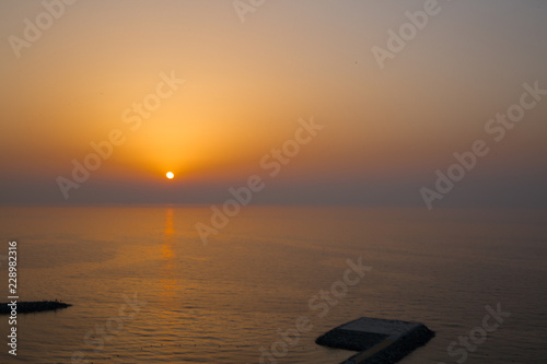 Fényképezés Panoramic view of sunset and helipad (landing area or platform for helicopters) in the Indian ocean