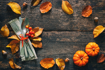 Wall Mural - Autumn background with vintage place setting on old wooden table