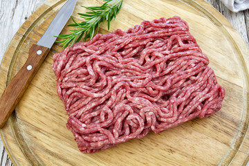 Wall Mural - raw minced meat on wooden board