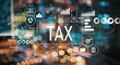 © Tierney - Tax with blurred city abstract lights background