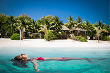Beautiful Girl Swiming On White Sand At Tropical Olhuveli,  Maldives.