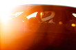 A Race Car Driver At The Wheel Waiting To Take To The Track As The Early Morning Sun Rises In The Background