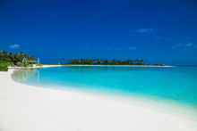 Beautiful Beach With White Sand At Tropical Olhuveli Island, Maldives.