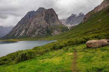 Wall Mural - Nianbaoyuze - Holy Mountain in Jiuzhi County. Located in the Grassland of Guoluo Plain, Qinghai Province, China. High Altitude Goddess Lake, Mountains and flowers. Holy Tibetan Lake, Hiking Trekking