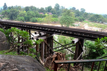 River Kwai Train Crossing The Wampoo Viaduct On The Death Railway Above The River Kwai Valley Near Nam Tok, Kanchanaburi