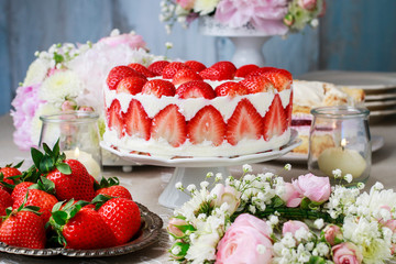 Wall Mural - Party table with fruits, flowers and strawberry cake