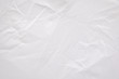 © Lemonsoup14 - Abstract creased fabric texture background. Crumpled white textile material pattern.