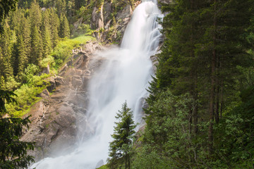  View Alpine inspiring Krimml waterfall in mountains in summer day. Trekking in National park Hohe Tauern, Austria