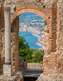 Fototapeta  - Ruins of the Ancient Greek Theater in Taormina with the sea in the background. Province of Messina, Sicily, southern Italy.