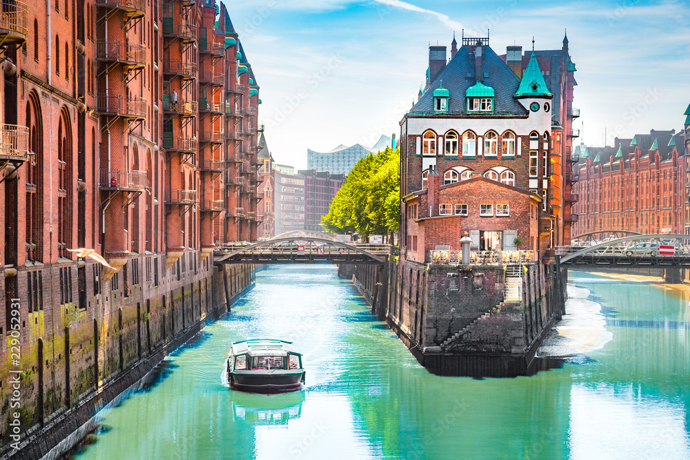 Hamburg Speicherstadt with sightseeing tour boat in summer, Germany - obrazy, fototapety, plakaty 