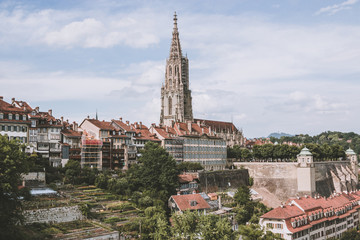 Panoramic view on Bern Minster and historic old town of Bern, capital of Switzerland, Europe. Summer landscape, sunny day and blue sky