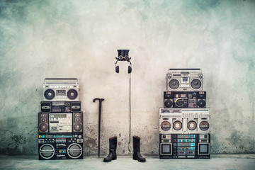 Wall Mural - retro old design ghetto blaster boombox radio cassette tape recorders, headphones, cylinder hat, lea