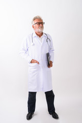 Wall Mural - Full body shot of handsome senior bearded man doctor standing an