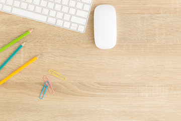 Wall Mural - flat lay photo of office desk with mouse and keyboard ,top view workpace on wood table and copy spac