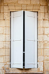 Wall Mural - Old window with wooden white painted shutters