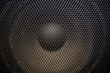 musical powerful speaker with a protective grill close-up.