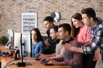 Sticker - Young people playing video games at tournament