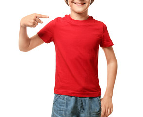 Wall Mural - Little boy pointing at his t-shirt on white background