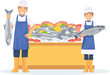 Two fishmonger sell fresh fish in the market