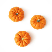 Autumn Composition Of Little Orange Pumpkins Isolated On White Table Background. Fall, Halloween And Thanksgiving Concept. Styled Stock Flat Lay Photography. Top View, Square. Vegetable Design.