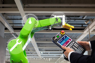 Aufkleber - Engineer with teach pendant device. Programming robot with robotic arm. Smart factory 