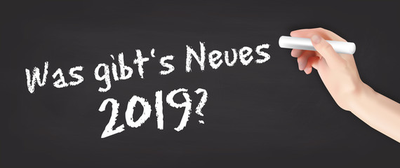 Sticker - Hand schreibt auf Kreidetafel - Was gibt's Neues 2019