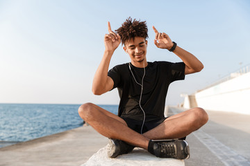 Smiling young african teenager at the beach