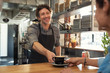 © Rido - Waiter serving coffee to customer
