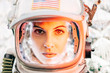 © ADDICTIVE STOCK - Beautiful woman poses looking at camera dressed as an astronaut.