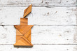 © bankrx - Tangram puzzle in candle shape on old white wood background