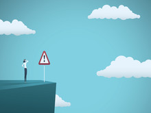 Business Risk Vector Concept. Businessman Standing On The Edge Of Cliff With Warning Sign. Symbol Of Danger, Failure, Bankruptcy, Recession And Crisis.