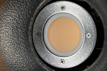 Close-up - Yellow Diffusing Filter Part Of Studio Illuminator With Four Screws On The Iron Part. Studio Equipment Concept